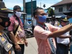 Sosialisasi Perbup Deliserdang, Tim Gabungan Dishub Bagikan Masker di Birubiru