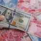 Nilai tukar rupiah ditutup menguat 128 poin atau sekitar 0,71 persen ke level Rp17.860 per dolar AS pada perdagangan, Jumat (12/6/2026). Foto: Ist.