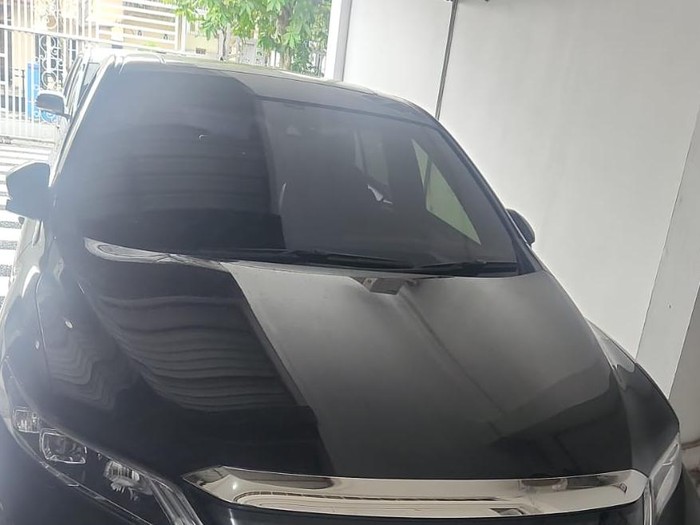 Satu unit mobil Toyota Harrier warna hitam milik tersangka Haradongan Simanjuntak yang disita penyidik Dittipidnarkoba Bareskrim Polri saat penangkapan bandar besar narkoba di Rokan Hilir, Riau (Foto: Dok. Polisi).