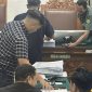 Polda Metro Jaya menghadirkan tumpukan dokumen bukti penetapan tersangka Roy Suryo sah. Foto: Ist.